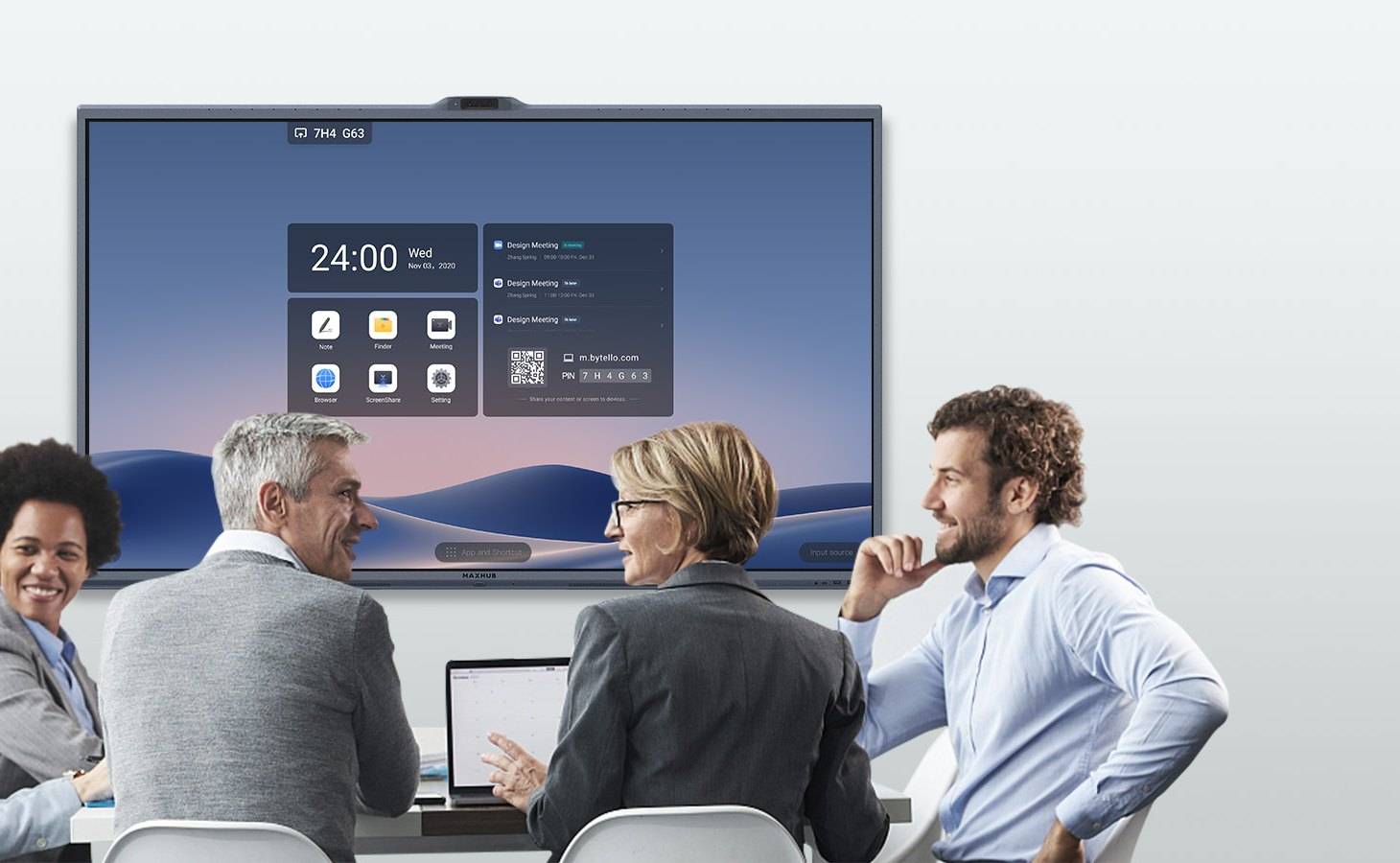 Team meeting around a conference table with an all-in-one display